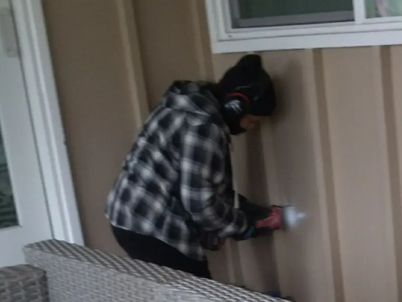 Professional electrician installing an exterior outlet in Lyons